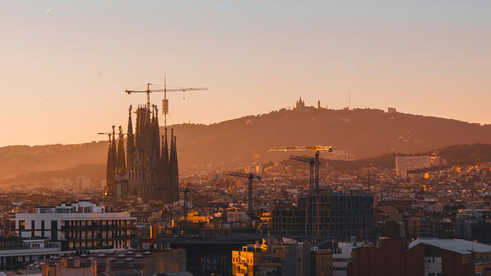 Romantic rooftop dinner for two over Barcelona at sunset