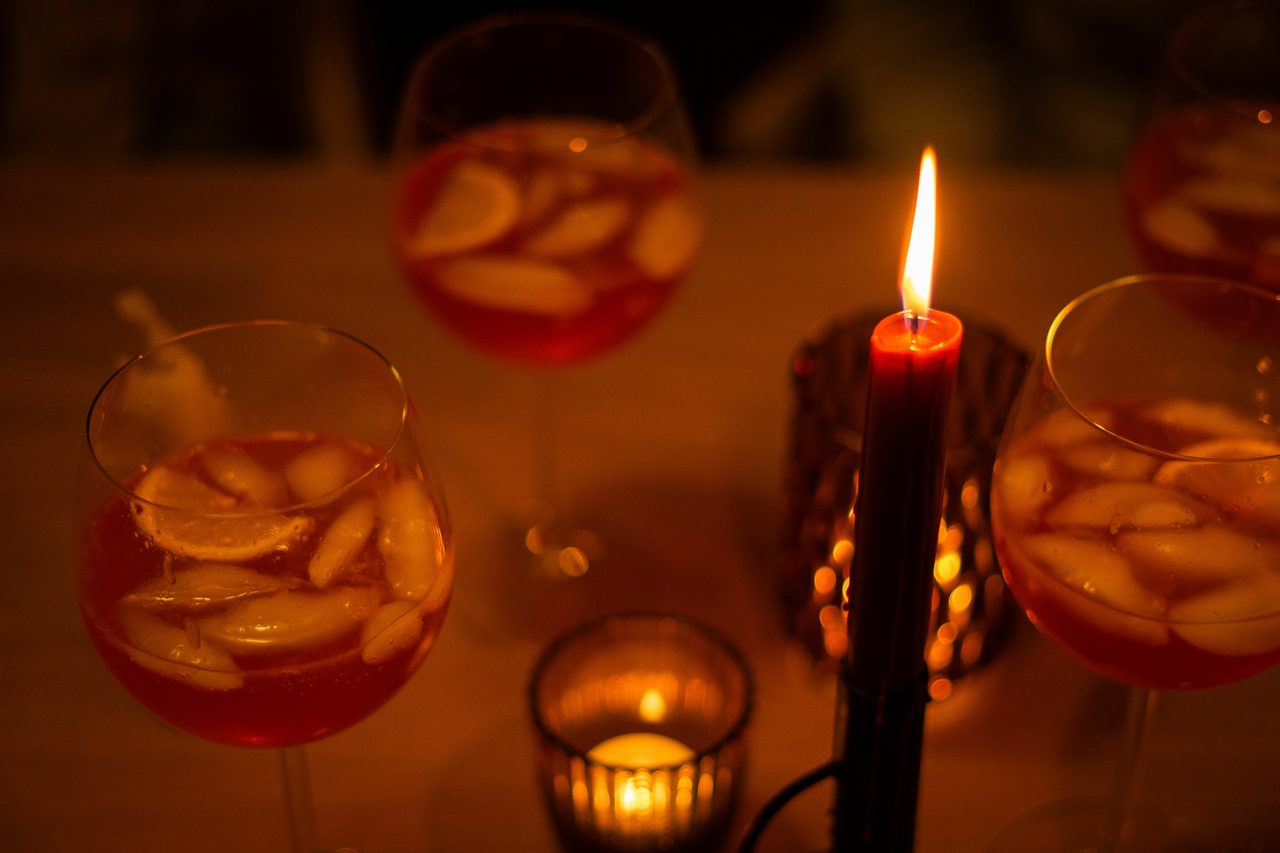 Couple at a cosy candlelit wine bar in Barcelona
