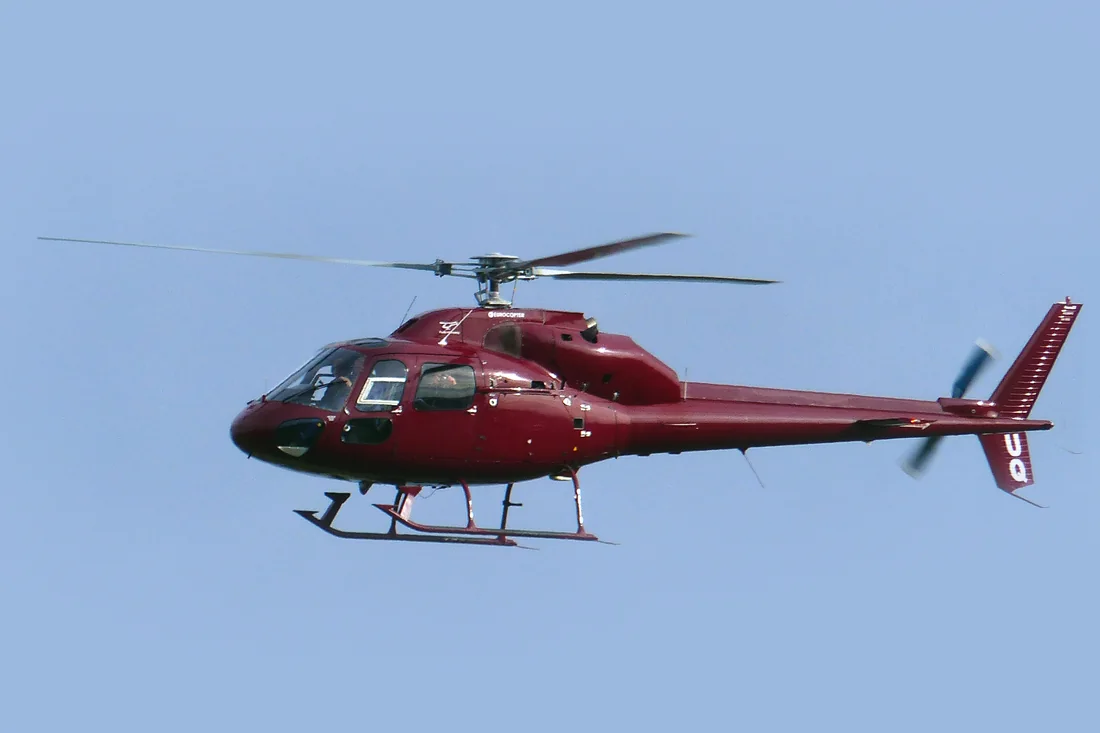 An Airbus AS355 Ecureuil helicopter in flight