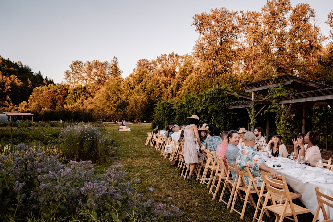 Vineyard wedding reception with a long table among the vines